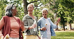 Happy women, water or walking with personal trainer in park for cardio exercise or outdoor workout. Female people, coach or laughing with smile for fun physical activity, health or wellness in nature
