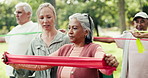 Personal trainer, old woman and exercise outdoor with resistance band, fitness and stretching arms. Coach, elderly people and smile in park with help for workout, mobility and physical therapy class.