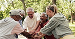 Senior, happy people and hands together with unity for teamwork, celebration or fitness goals. Elderly, group or excited community with smile, pile or stack for health and wellness mission in park