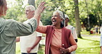 Fitness, high five or laughing with old woman and personal trainer in park for mobility class. Excited, exercise or success with coach and funny senior people outdoor in nature for course or lesson