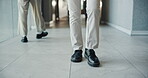 Business, feet and walking with person in office corridor for start of career, job or work. Legs, shoes and steps with employee man in workplace hallway for commitment, development or opportunity