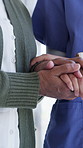 Holding hands, walking and nurse with senior woman in retirement home for bonding or compassion. Empathy, support and caregiver with elderly female patient for connection at medical checkup in house.