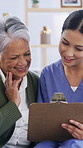 Senior woman, nurse or checklist with clipboard for healthcare exam or diagnosis in retirement home. Female person, caregiver and elderly patient with smile for medical history or assessment in house