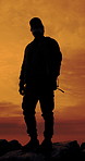 Man, silhouette and mountain with reflection, sunset sky or bag for travel on summer adventure. Person, outdoor and thinking for perspective, gear or view for sightseeing on hill on trekking journey