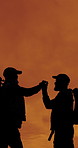 People, silhouette and handshake for hiking goals, sunset sky and friends with space on mountain. Men, teamwork and success on rocks, hill or celebration in summer for trekking challenge in nature
