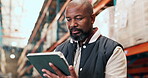 Logistics, tablet and reading with black man in warehouse for inventory manager, research and delivery report. Inspection supervisor, online checklist and shipping storage with person  in factory
