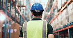 Back, man and walking for supply chain in warehouse for inspection, quality control and logistics. Person, storage or stock check for export, inventory management and supervisor of cargo distribution