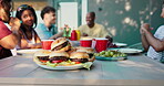 BBQ, food and friends with hamburgers in backyard for social gathering, new years party or reunion. Summer holiday, people or barbecue lunch outdoor at house for weekend break, celebration or cookout