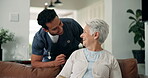Smile, talking and nurse with old woman on sofa for medical, advice, support and retirement. Elderly care, healthcare and caregiver with senior patient and man in living room of nursing home for help