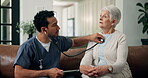 Stethoscope, consulting and nurse with old woman on sofa for medical, support and breathing. Heartbeat checkup, healthcare and caregiver with senior patient and man in nursing home for help and exam