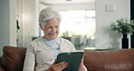 Relax, tablet and laughing with old woman on sofa for social media, ebook subscription or app. Online library, retirement and joke with senior person and tech in living room of home for weekend break