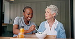 Feeding, home and caregiver with senior woman with food for lunch, meal or snack for health. Retirement, helping and nurse with elderly patient eating for care, assisted living and medical service