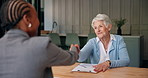 Senior woman, handshake and advisor in home for real estate deal, agreement and purchase. Elderly person, shaking hands and thank you for consultation, retirement benefits and financial negotiation
