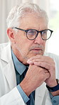 Thinking, doctor and mature man reading for patient report, treatment plan and wellness in office. Healthcare, clinic and person with glasses for medical research, decision and solution for diagnosis