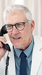 Telephone call, doctor and man in hospital for healthcare, conversation and telehealth update. Landline, mature person and medical professional speaking to contact for consultation, report or results