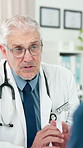 Doctor, mature man and consultation in clinic for healthcare advice, wellness or update with checkup. Medical professional, patient and talk to person for help with treatment planning in appointment