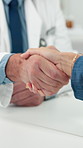 Doctor, handshake and checkup with person in office for greeting, introduction and welcome. Healthcare worker, shaking hands and patient for consultation, medical agreement and thank you for services