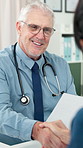 Doctor, document and man with handshake in clinic for healthcare agreement, wellness or thank you. Shaking hands, medical paper and mature person with patient for recovery success, support and smile