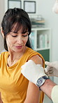 Hands, doctor and bandage with woman for vaccination, first aid and injection for wellness. Healthcare worker, person and help with plaster, medical checkup and wound protection of immunization shot