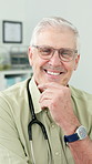Face, happy man and mature doctor with confidence in clinic, wellness and healthcare career. Portrait, person and medical professional with smile, physician or general practitioner with glasses in Uk