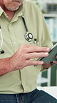 Hands, doctor and man with tablet for healthcare research, scroll or check patient history. Mature person, technology and medical professional in hospital for wellness email, records and report