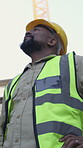 Outdoor, mature or black man with inspection on construction site, review or check infrastructure progress. Building development, plan or contractor with project evaluation, below or quality control