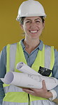 Woman, architect and face in studio, blueprint and helmet with construction worker on yellow background. Person, engineer or happy in portrait with floor plan, pride and property development in Spain