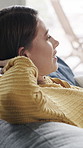 Woman, relief and stretching on sofa with smile, thinking and reflection with break, memory or nostalgia. Person, happy and rest on couch for perspective, inspiration or relax in living room at house