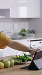Knife, hands and woman with apple for recipe in kitchen for cooking, meal or diet snack in morning. Ingredients, tablet and female person chopping fresh fruit for nutrition supper or dinner in house.