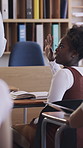 Teacher, learning and help student with hands up for question education and knowledge with teenager. Girl, classroom and answer with educator for teaching, feedback and book for high school lesson