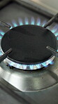 Gas stove, burner or blue fire in kitchen with preparation, heat circle or warm plate in cooking appliance. Culinary, equipment or hob with flame, catering process or cooker in dining element.