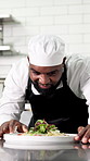 Black man, chef and cooking with plate, presentation or salad for cuisine career at restaurant. African person, food and smile with thinking, garnish or quality assurance with catering job in kitchen