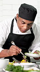 Chef, man and plating food with herbs in restaurant for lunch service, fine dining and aesthetic presentation. Hospitality industry, person and garnish meal in kitchen for cuisine flavor and catering