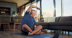 Man, stretching and pilates with laptop, home and workout routine in lounge, online and flexibility. Happy, mature person and exercise preparation on floor, balance and tips on web or tech in house
