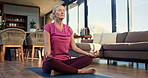 Senior woman, yoga and breathing exercise in home on floor with lotus, wellness and zen in morning. Elderly person, holistic fitness and prayer hands with mindfulness, mat and retirement at apartment