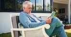Backyard, chair or senior man with tablet for reading, wellness ebook or retirement forum for online advice. Outdoor, browsing internet or elderly person with tech to check news outlet, calm or relax