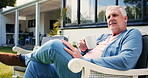 Thinking, coffee and senior man in backyard, relax and retirement with afternoon break. Outdoor, house and mature person with ideas, memory and herbal tea with moment, pensioner and nursing facility