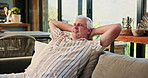 Relax, stretching and senior man on sofa in home for chilling, comfortable and enjoy calm on Sunday afternoon. Retirement, morning and mature person on couch for rest, lazy and peace in living room