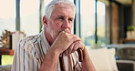 Senior man, walking stick and thinking on sofa, memory and reflection in living room with nostalgia. Elderly person with disability, cane and perspective for rehabilitation with injury at apartment