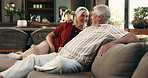 Senior couple, talk and laugh on couch for bonding, love and care with funny story in lounge at house. Elderly man, woman and chat with happy memory, discussion or relax on sofa in retirement home