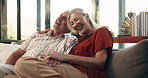 Senior, happy couple and laughing on sofa for comedy, humor or bonding together in home. Elderly, man and woman relaxing with smile on living room couch for funny joke, love or conversation in house