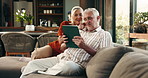 Tablet, discussion and senior couple on sofa with planning for retirement vacation together in home. Talking, digital technology and elderly people in living room with booking flight tickets in house