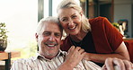 Old couple, face and happy on sofa in home, holding hands and connection with love in retirement. Elderly man, woman and smile in portrait, relationship and laugh with bonding at house in New Zealand