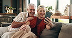 Senior couple, phone and video call at house with discussion, friendly chat and bonding together. Smile, elderly people and mobile app for online conversation, contact and funny joke in living room