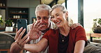 Old couple, wave and phone for video call at house with discussion, friendly chat and bonding. Smile, elderly people and greeting with mobile for online conversation, contact and funny joke in lounge