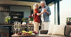 Charcuterie board, home and old couple with love, dancing and bonding together with celebration. Music, happy man or woman with food, alcohol and relationship with romance, marriage and snack platter