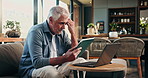 Tablet, laptop and fail with old man on sofa for mortgage debt, retirement funds and planning. Online banking, digital invoice and foreclosure notice with senior person in home for pension account