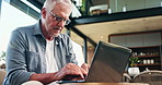 Typing, laptop and research with old man on sofa for mortgage payment, retirement funds and planning. Online banking, digital invoice and low angle with senior person in home for pension account