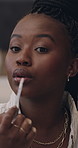 Influencer, lipgloss and face of black woman with makeup in home for opinion, how to and tutorial. Content creator, portrait and person with cosmetics for product review, beauty tips and social media