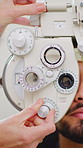 Eye exam, man and hands of optometrist with phoropter for vision, checkup and eyesight assessment. Test, machine and person with ophthalmologist for health, visual wellness or consultation in clinic